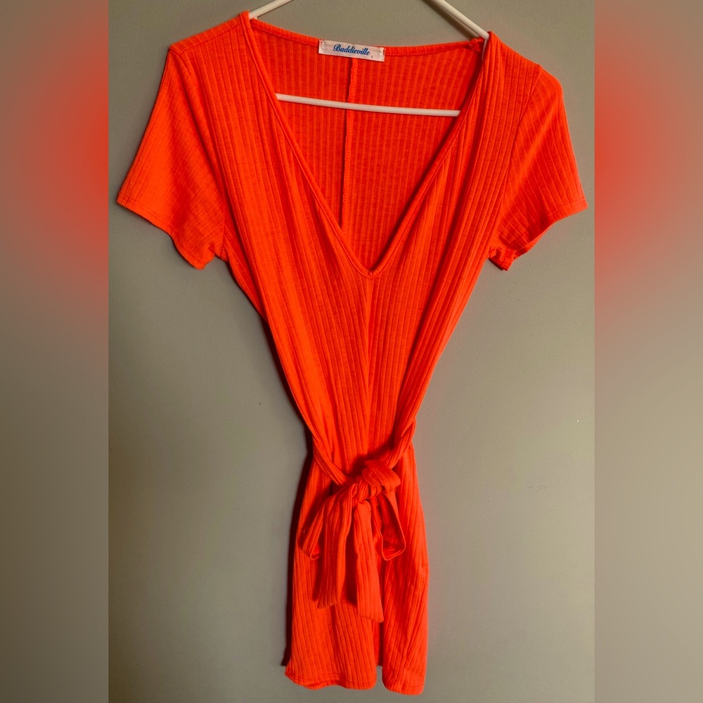 Baddieville one-piece romper in the color orange. Size Large. Lightly worn.